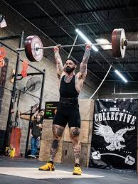 Olympic Weightlifter resting between sets