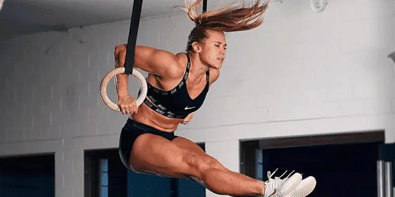 CrossFit athlete doing burpees and bike sprints